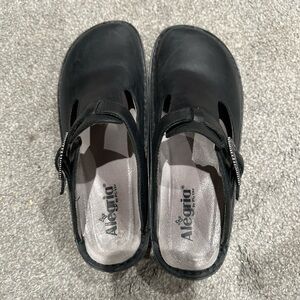 Alegria Black Cut-Out Slip-On Shoes